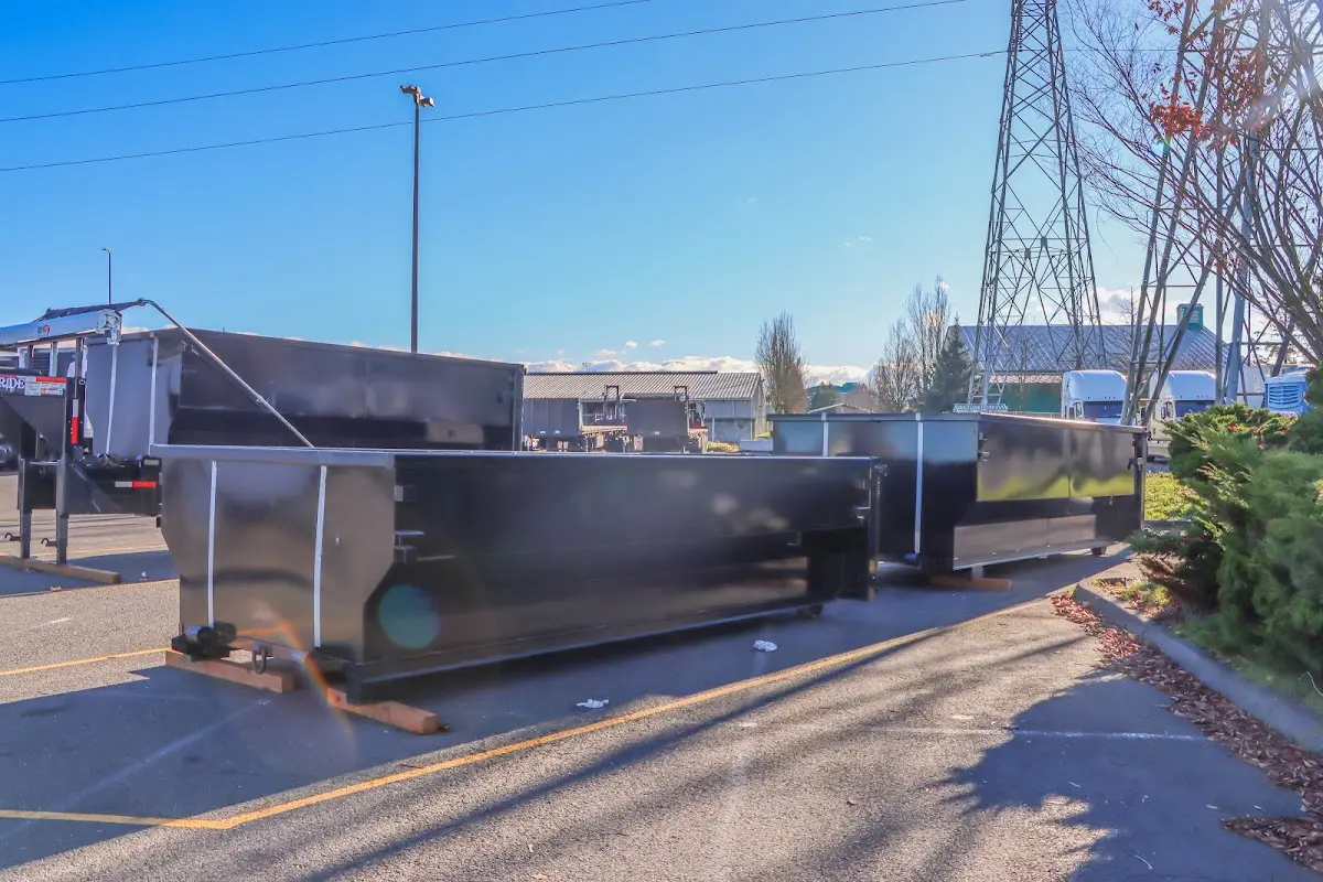 Roll-off dumpster ready for waste disposal at job site for Concrete Dumpster Rental in Newberry